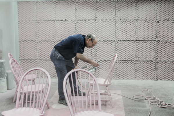Bulldog Movers Master Craftsman in the art of furniture Reuben Gooddine repairing some chairs